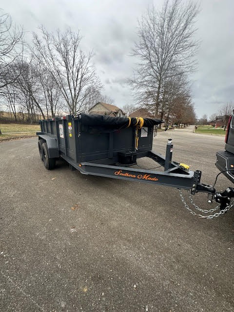 Dump trailer front angle - showing hitch and hydraulic lift system