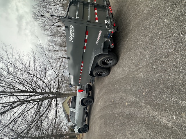 Dump trailer side profile - 14000lb GVWR capacity with red and white safety striping