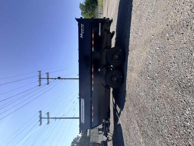 PJ Trailers 16ft dump trailer side view - Monster Rails branding on gravel lot